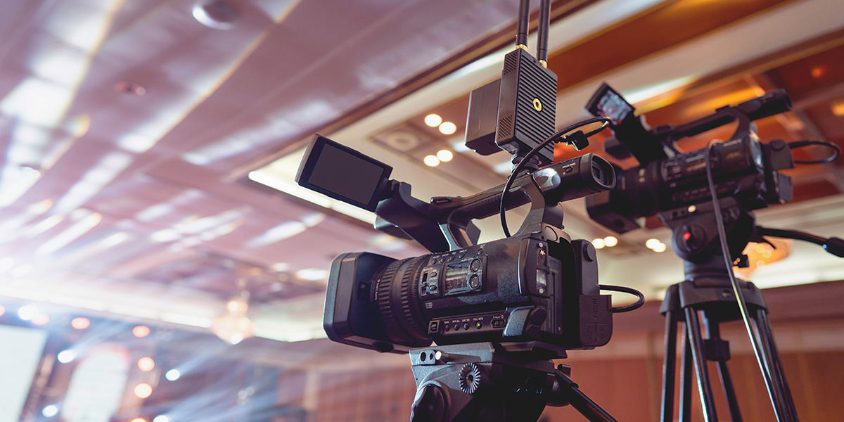 a video camera is sitting on a tripod in a room